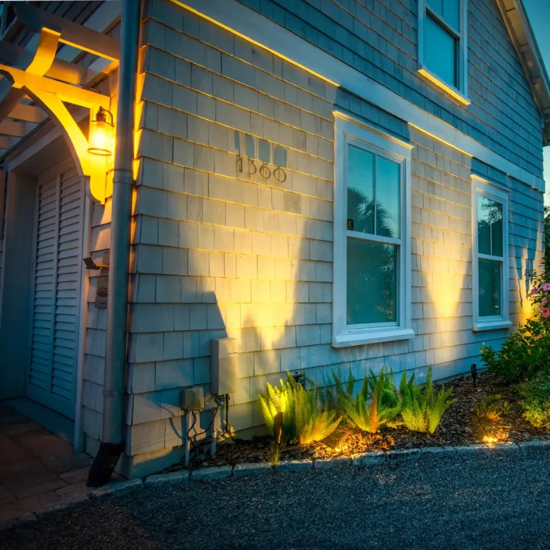 a home with upward landscaping lighting