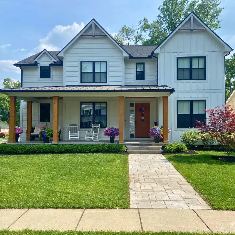 a perfectly manicured front yard due to custom touch outdoors landscaping services